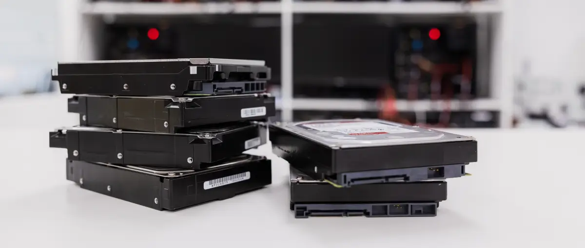 An image of several hard disk drives (HDDs) stacked together.