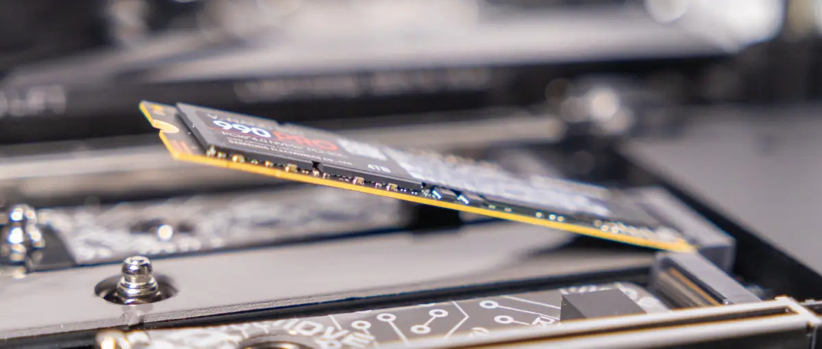 An image of a person installing a new M.2 NVMe SSD in their computer.