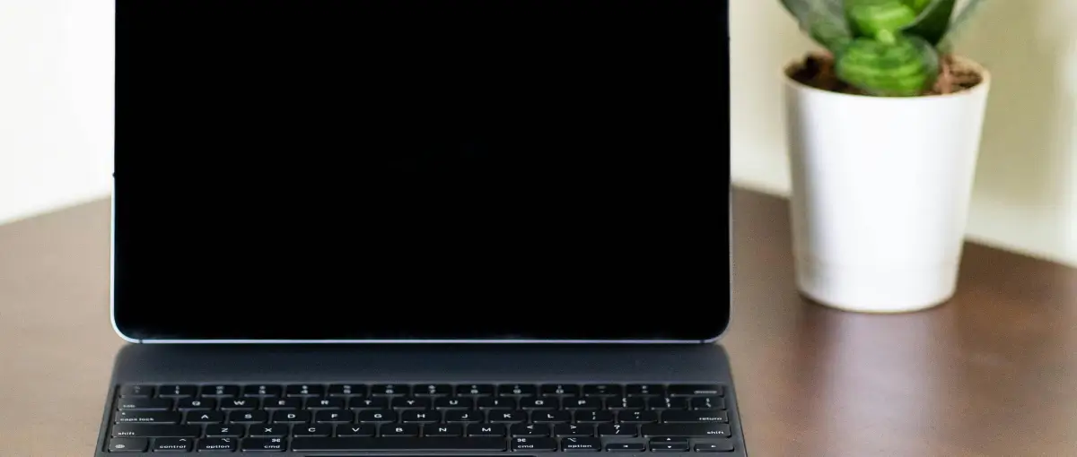 Frustrated fist on laptop keyboard