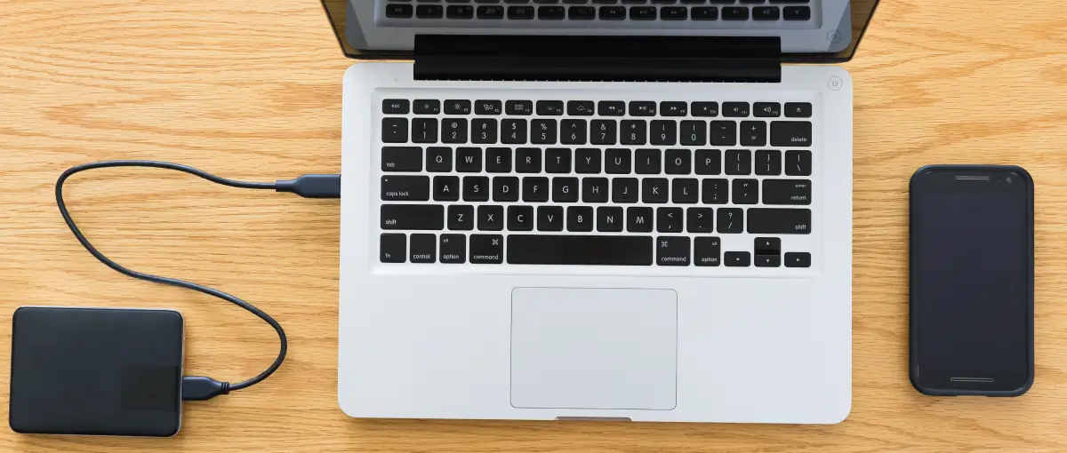A photo of an external hard drive connected to a Mac.