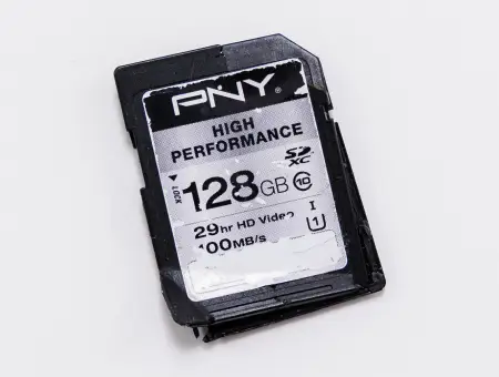 An image of a broken SD card on a blank background.