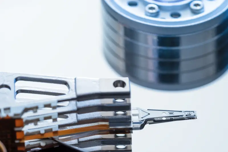 A close-up of read/write heads in a hard drive.